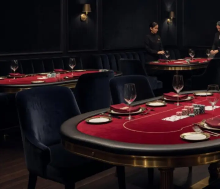 Elegant offline poker lounge with custom poker tables and fine dining setting